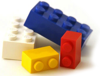 Four lego bricks in colors including: white, blue, yellow, and red.